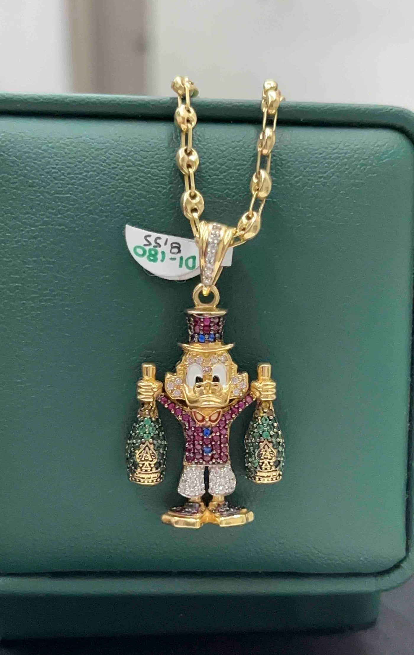DIJE TÍO RICO ORO AM 18K
