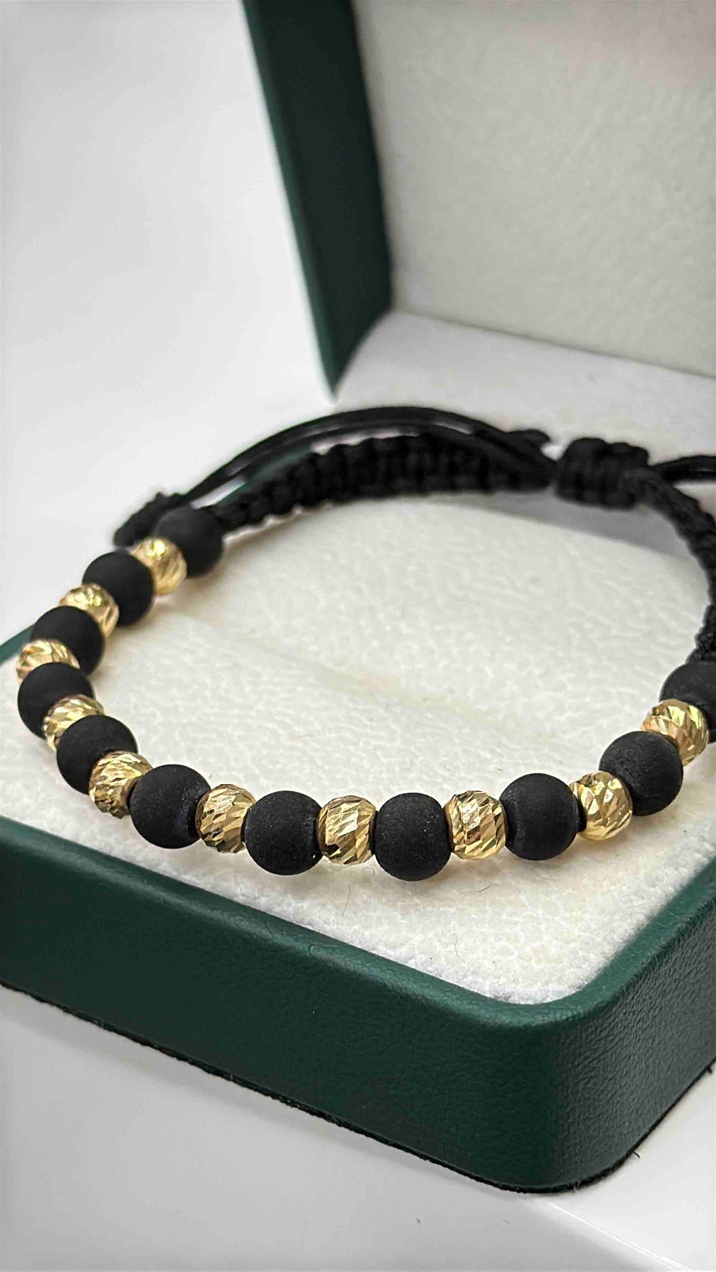 PULSERA TEJIDA ORO 18K NEGRA BOLAS NEOPRENO