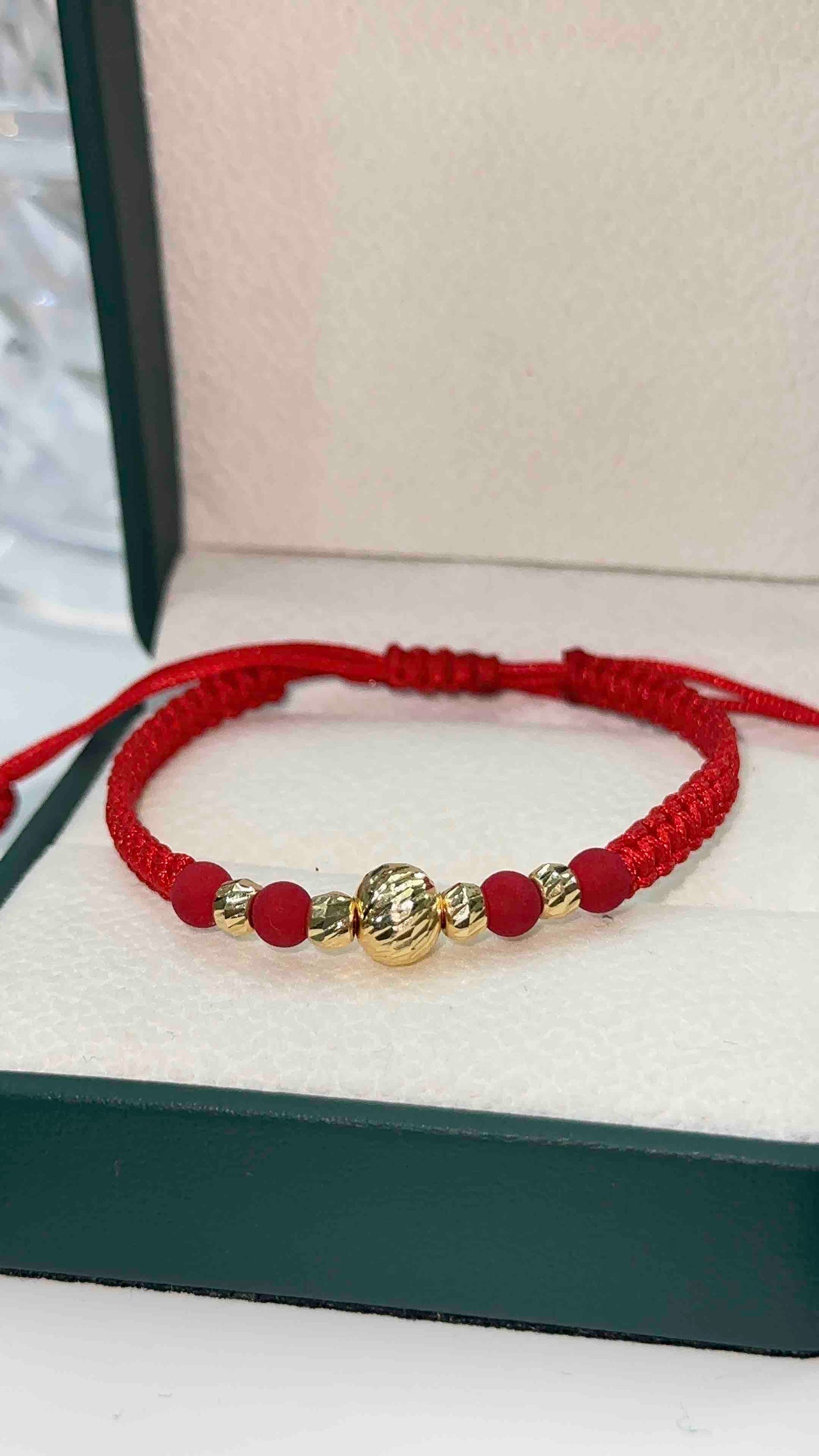 PULSERA TEJIDA ROJA BOLA