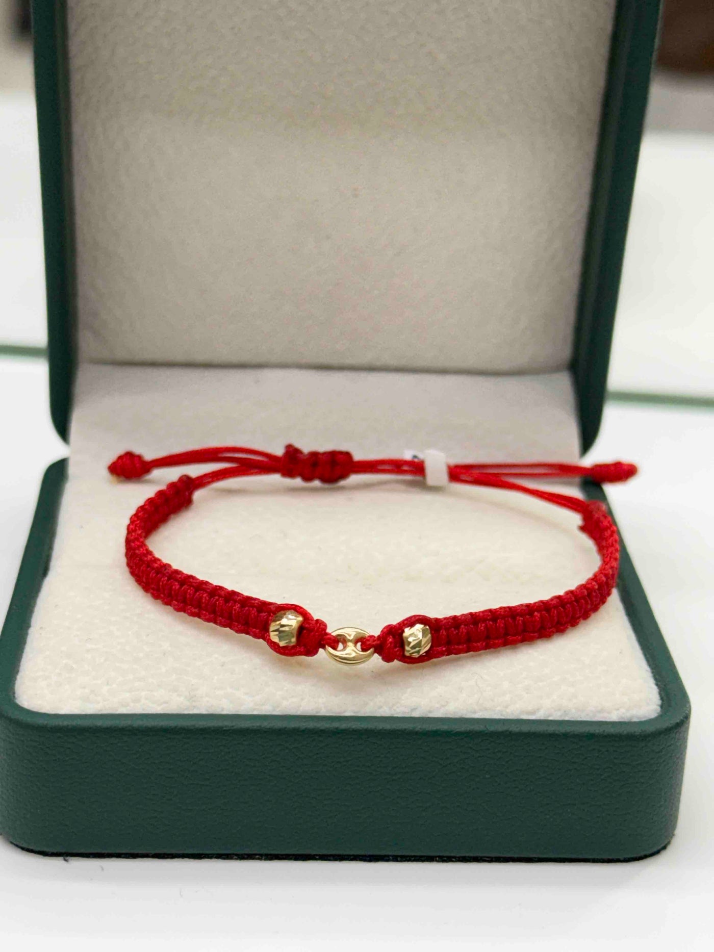 PULSERA TEJIDA ROJA HERRAJE GC BALINES ORO AM 18K