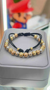 PULSERA TEJIDA TRES OROS BALIN LISO #7